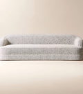 THE ONE × Mylene — Black and White Boucle Curved Sofa by goop
