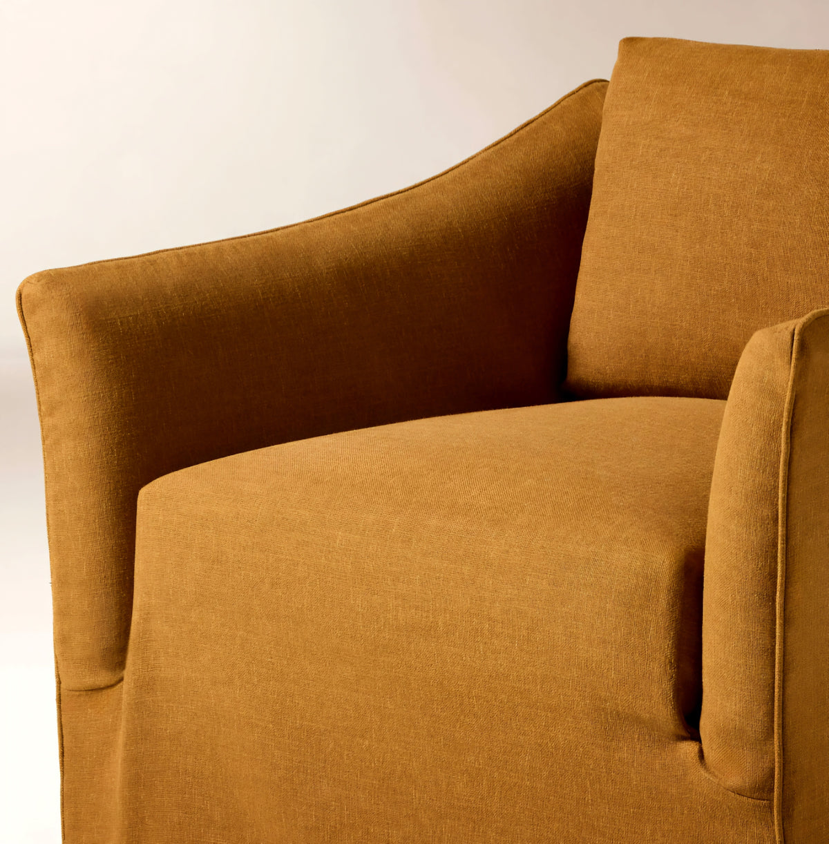 THE ONE × Bristol — Cognac Slipcovered Performance Linen Swivel Chair