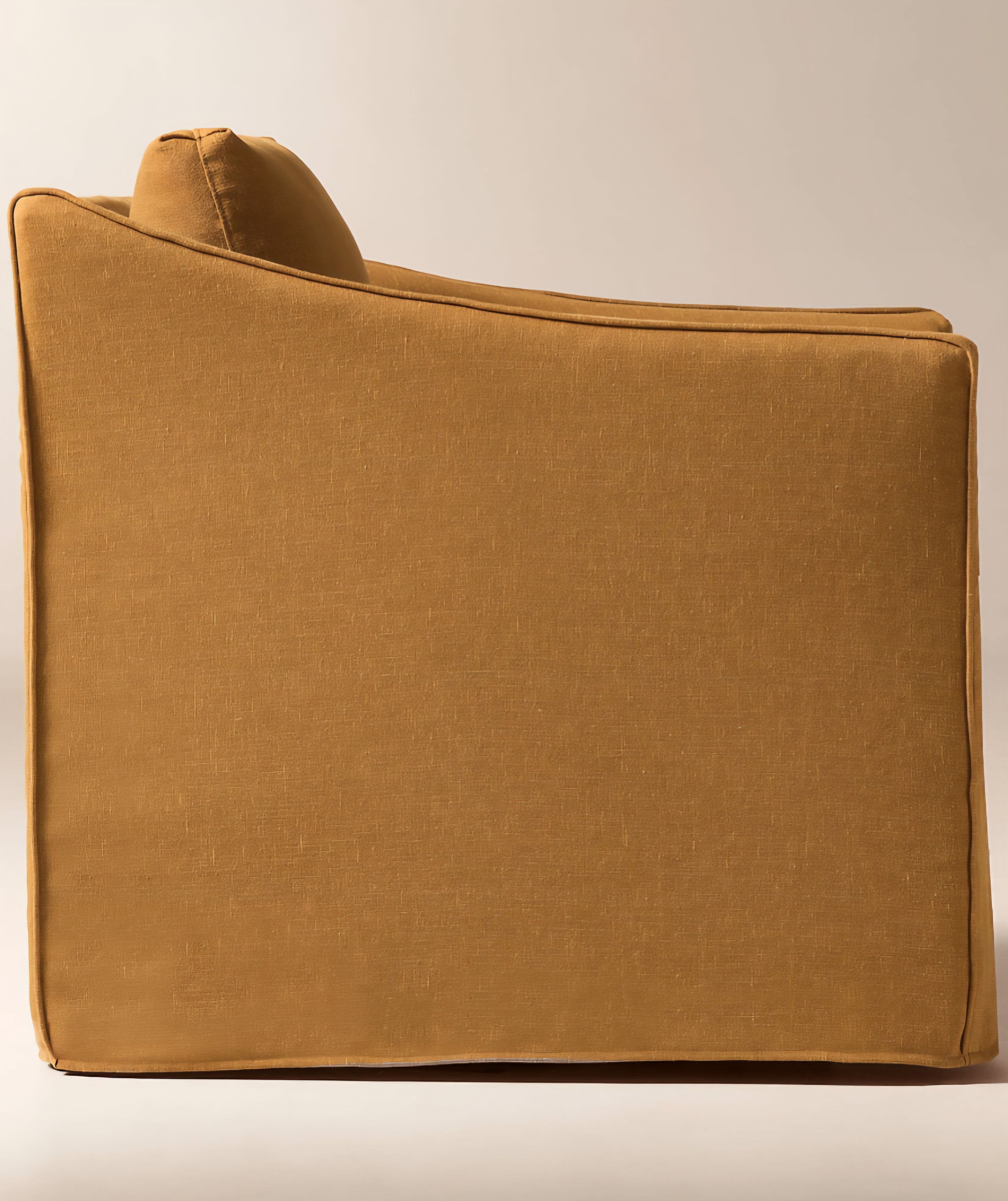 THE ONE × Bristol — Cognac Slipcovered Performance Linen Swivel Chair