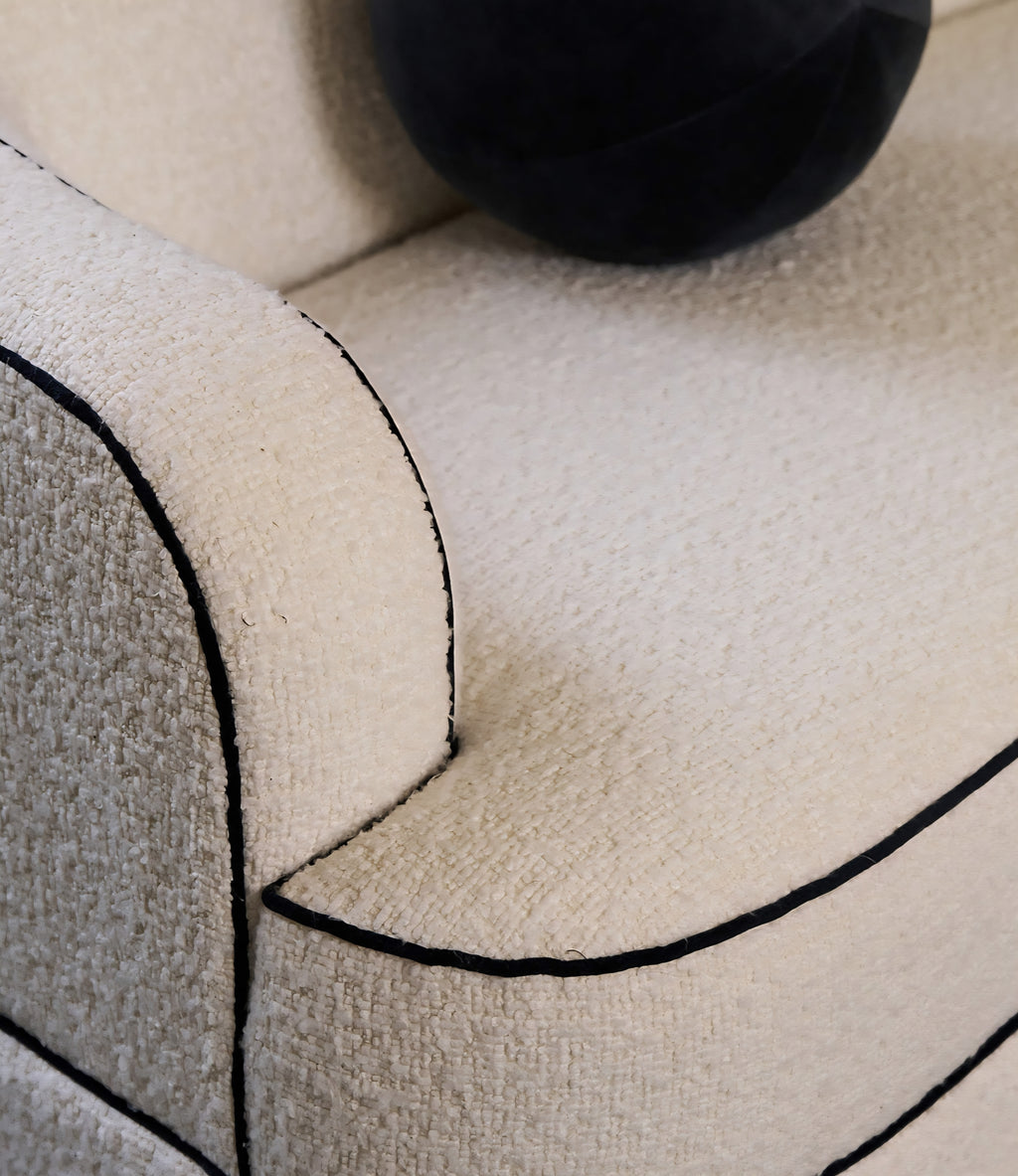 THE ONE × Mylene — Black and White Boucle Curved Sofa by goop