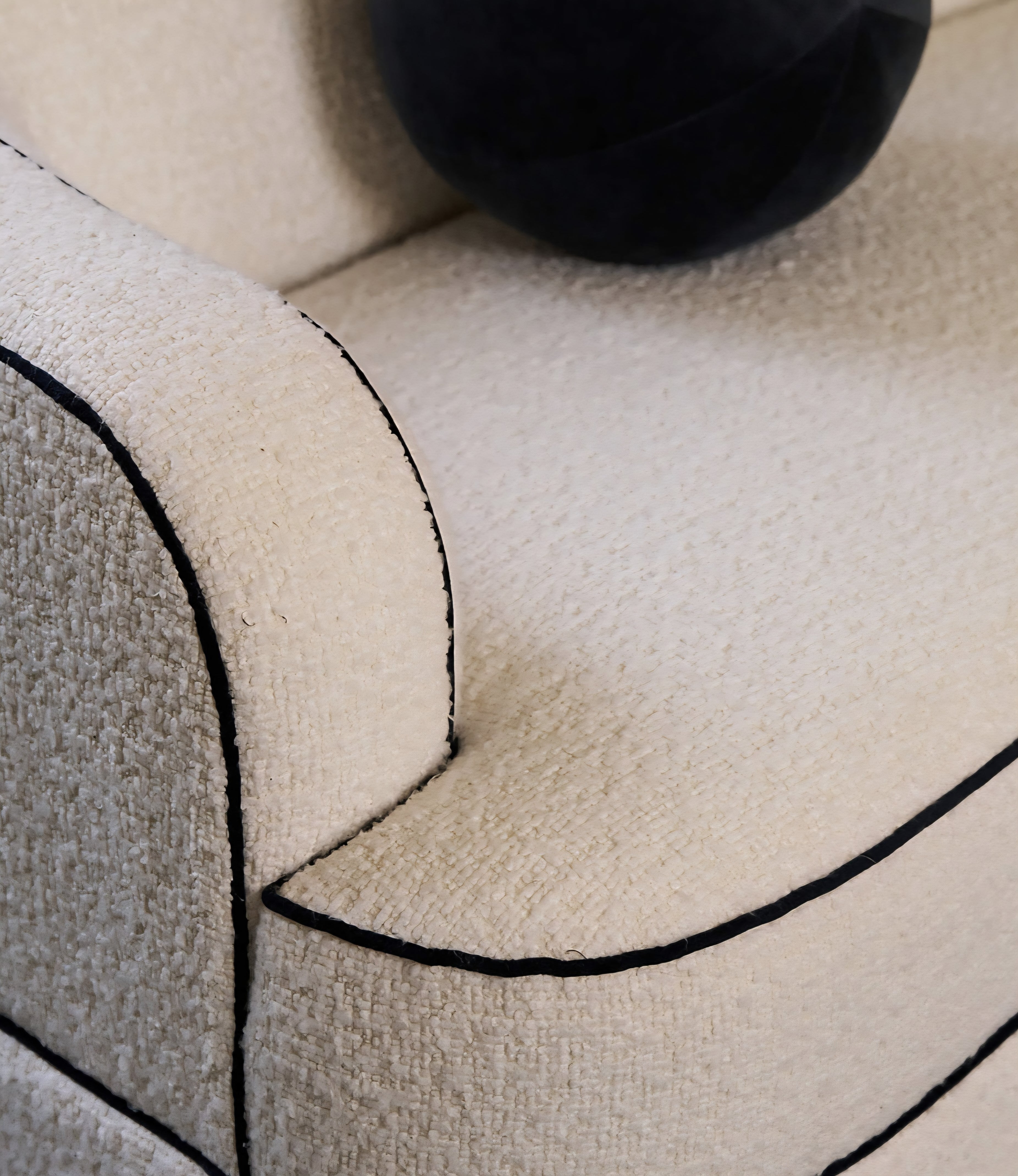 THE ONE × Mylene — Black and White Boucle Curved Sofa by goop